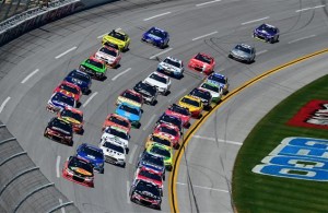 The field races in a tight pack during the NASCAR Sprint Cup Series GEICO 500 at Talladega Superspeedway. [Credit: Jared C. Tilton/Getty Images]