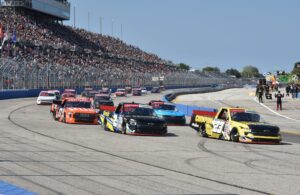 The Craftsman Truck Series returns to the Milwaukee Mile on a pace lap past the crowd in the stands. [John Wiedemann Photo]